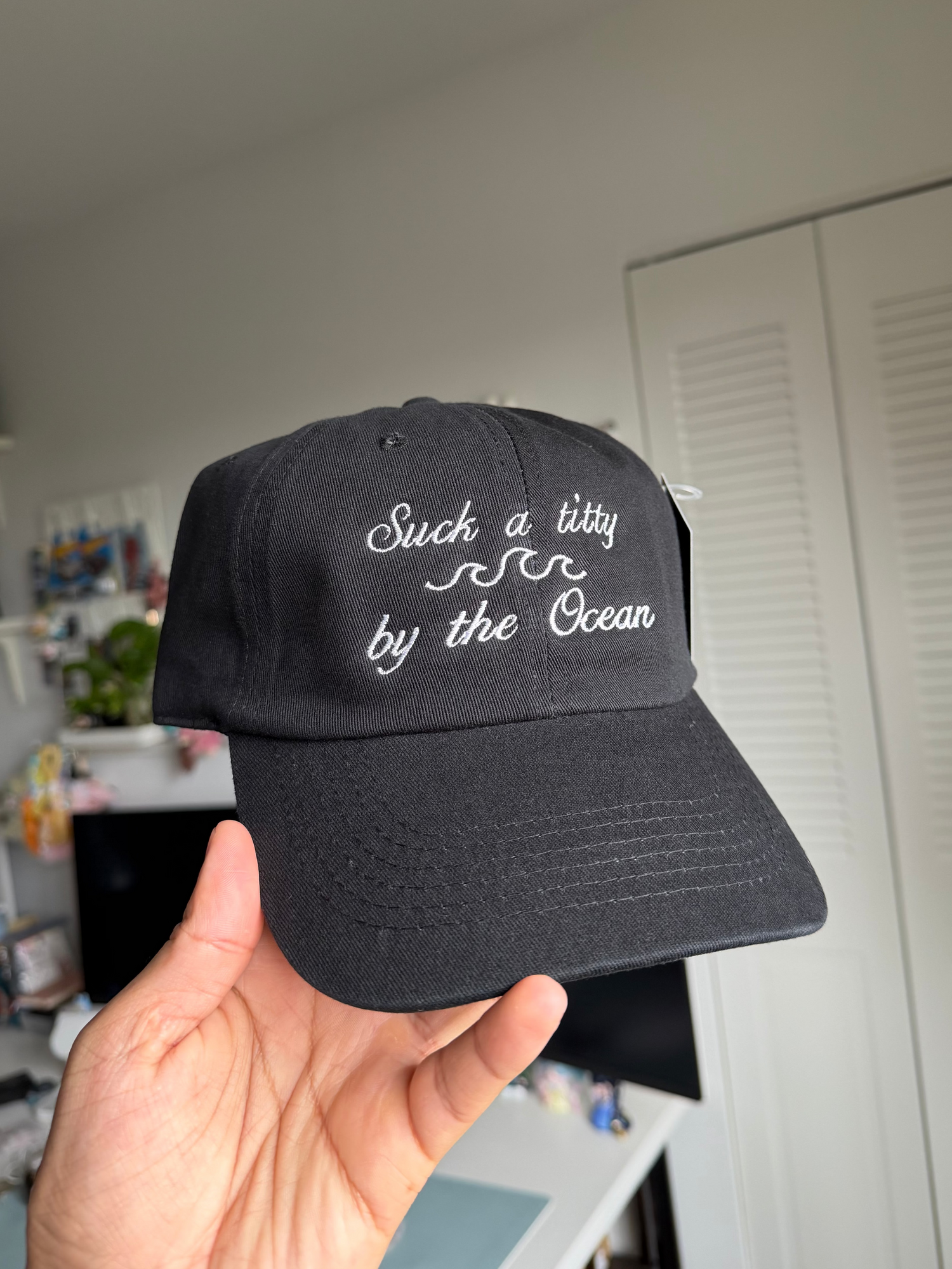 Black cap with white text