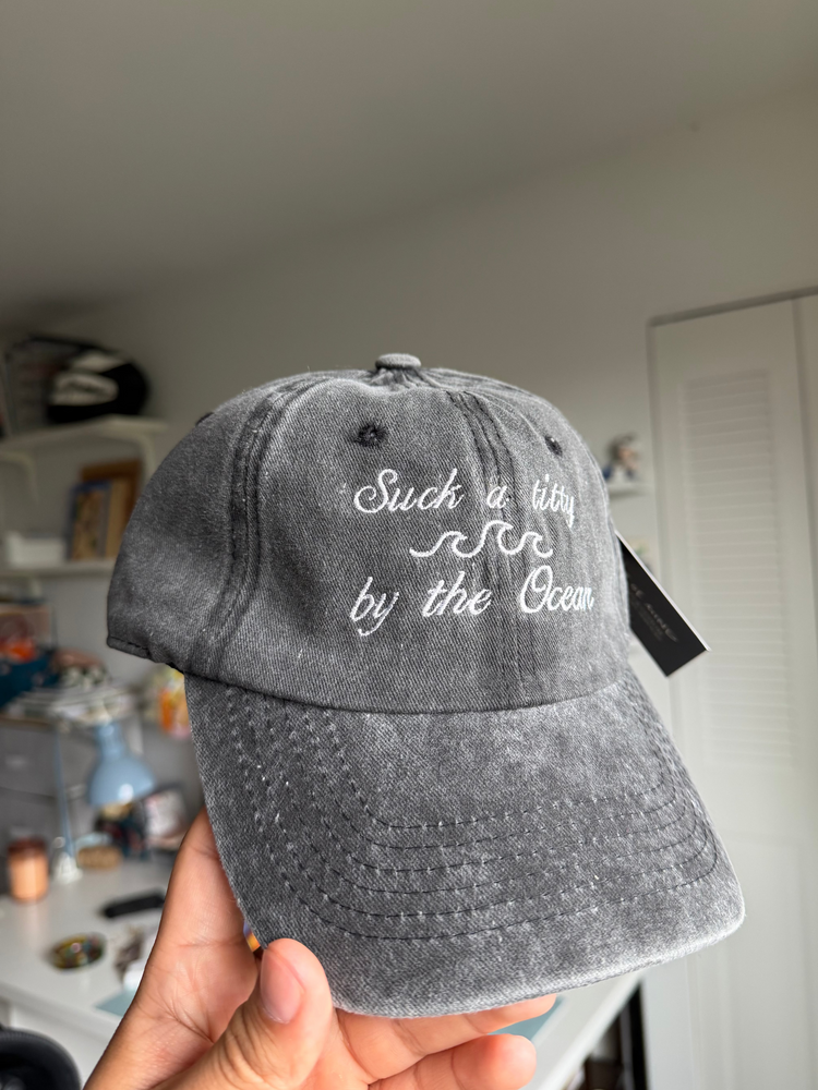Grey cap with white text