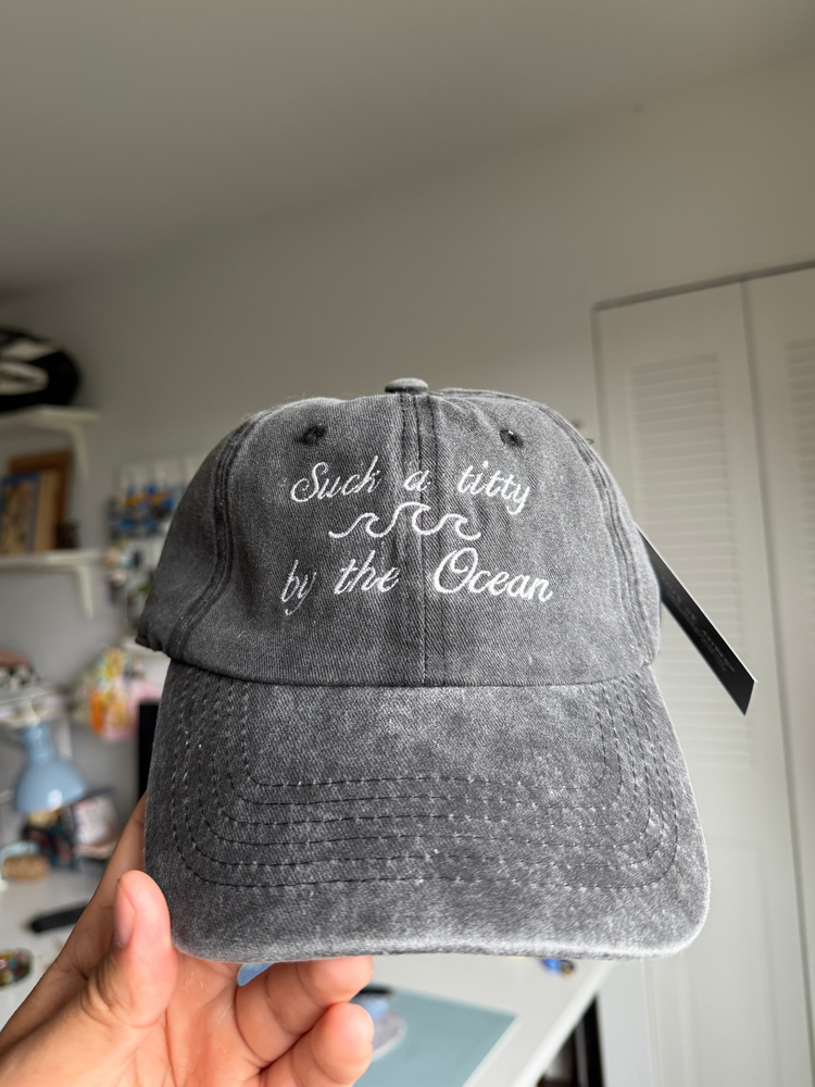 Grey cap with white text